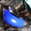 Aftermarket blue silicone hose installed in a car engine bay.